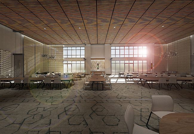 The image shows a large, modern conference room with numerous tables and chairs, a wooden ceiling, and large windows letting in sunlight.